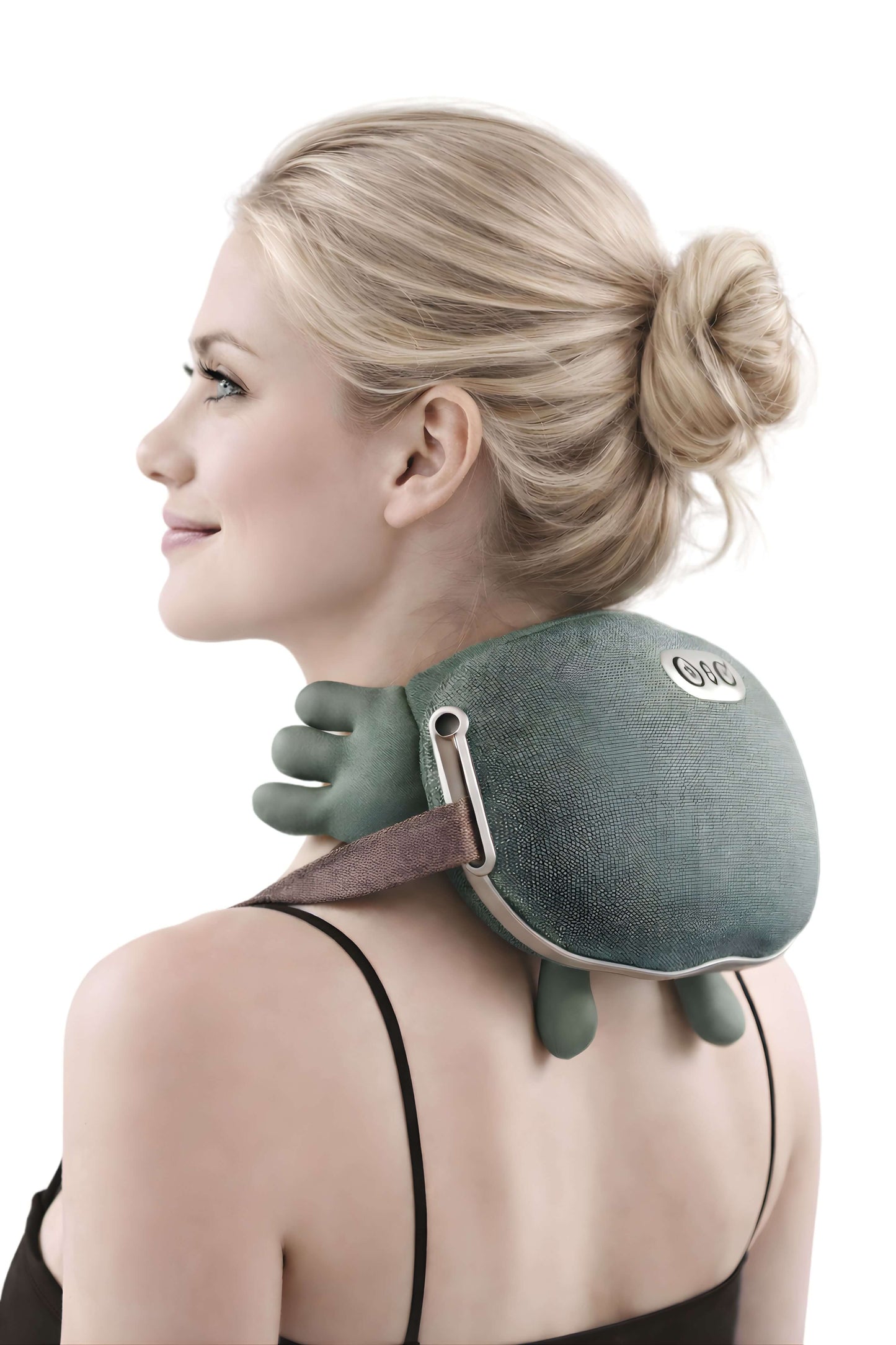 Woman wearing a green neck and shoulder massager.